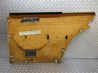 W124 rear left door card beige used OEM