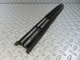 W115 front lower grill left used OEM