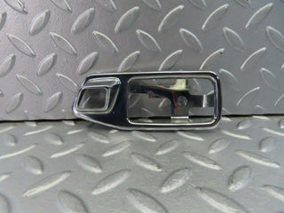 W123 chrome frame for door opener left used OEM