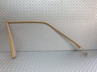 W124 front left door window frame trim palomino used OEM
