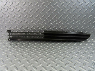 W115 front lower grill left used OEM