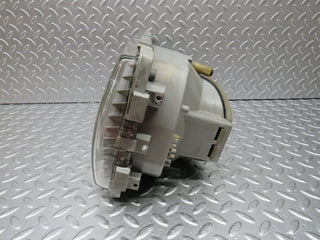 W123 headlight left side used OEM
