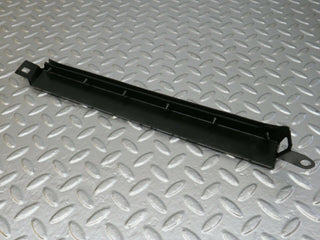 W124 Wagon under headlight trim left used OEM