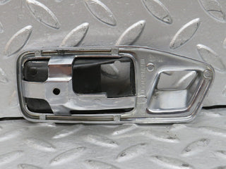 W123 chrome frame for door opener right used OEM