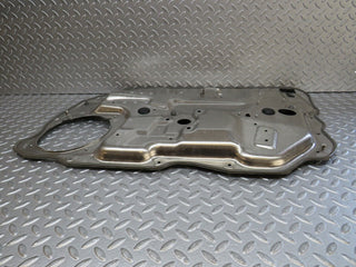 W221 front left window regulator support panel used OEM