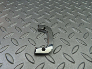 W123 left interior chrome door latch trim used OEM