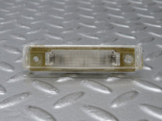 R129 SL number plate light used OEM