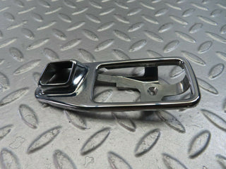 W123 chrome frame for door opener left used OEM