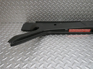 W124 trunk lock trim panel used OEM