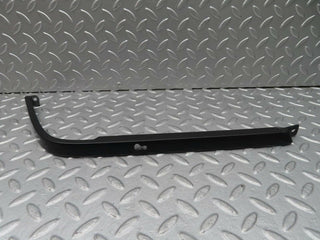 R129 SL right headlight lower trim used OEM