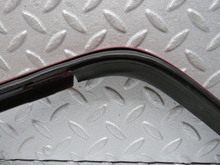 R129 SL left headlight lower trim used OEM