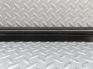 W123 front left door lower moulding trim used OEM
