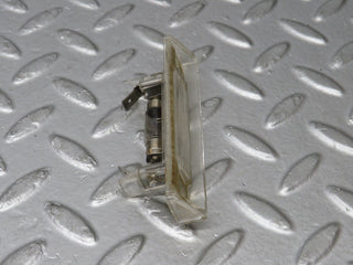 R129 SL number plate light used OEM