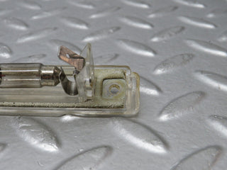 R129 SL number plate light used OEM