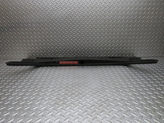 W124 trunk lock trim panel used OEM