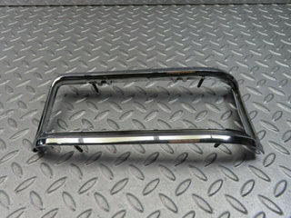 W115 tail light chrome frame left used OEM