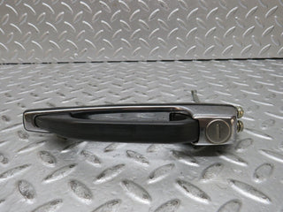 W123 front left exterior door handle used OEM