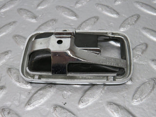 W123 chrome frame for door opener right used OEM
