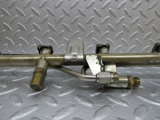 W124 Cabriolet fuel injector rail used OEM