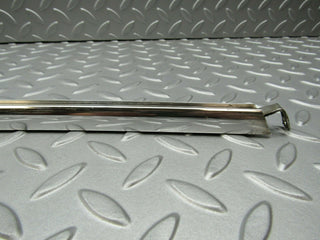 W115 rear left chrome window channel used OEM