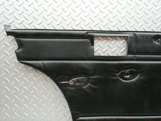 W115 rear left door card black used OEM