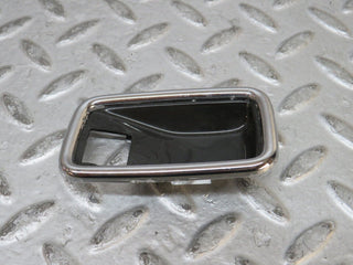 W123 chrome frame for door opener left used OEM