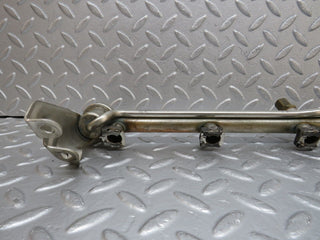 W124 Cabriolet fuel injector rail used OEM