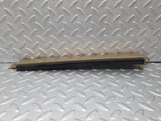 W124 under headlight trim left side used OEM