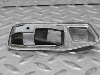 W123 chrome frame for door opener left used OEM
