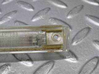 R129 SL number plate light used OEM