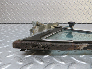 W109 front left quarter window glass used OEM