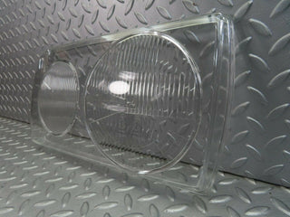 W123 headlight lens left used OEM