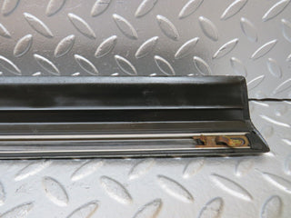 W123 front left door lower trim used OEM