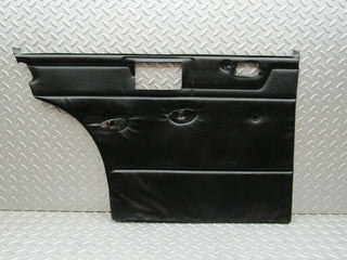W115 rear left door card black used OEM