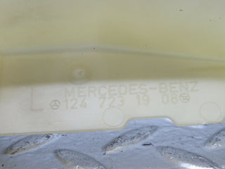 W124 Coupe left door lock mechanism cover used OEM