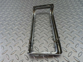 W115 tail light chrome frame left used OEM
