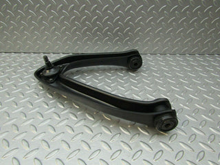 W115 upper control arm front left used OEM