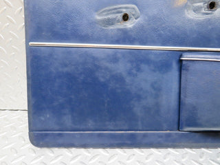 W109 front left door card blue used OEM