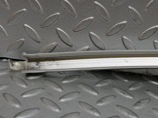 W123 rear left door chrome window channel used OEM