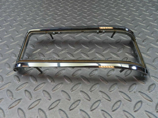 W115 tail light chrome frame left used OEM