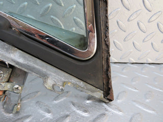 W109 front left quarter window glass used OEM