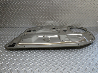 W221 front left window regulator support panel used OEM