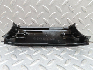 W123 b pillar bottom cover left black used OEM