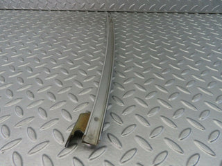 W116 rear left chrome window channel used OEM