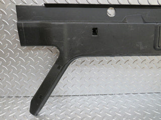 W124 trunk lock trim panel used OEM