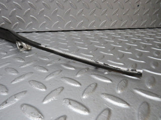 R129 SL left headlight lower trim used OEM