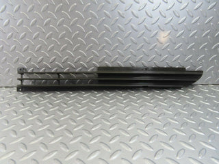 W115 front lower grill left used OEM