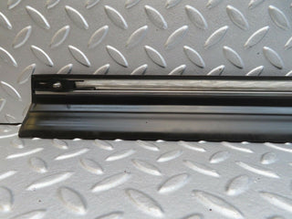 W123 front left door lower trim used OEM