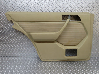 W124 rear left door card beige used OEM
