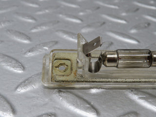 R129 SL number plate light used OEM
